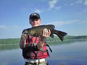 Boy with fish on Sennebec Lake